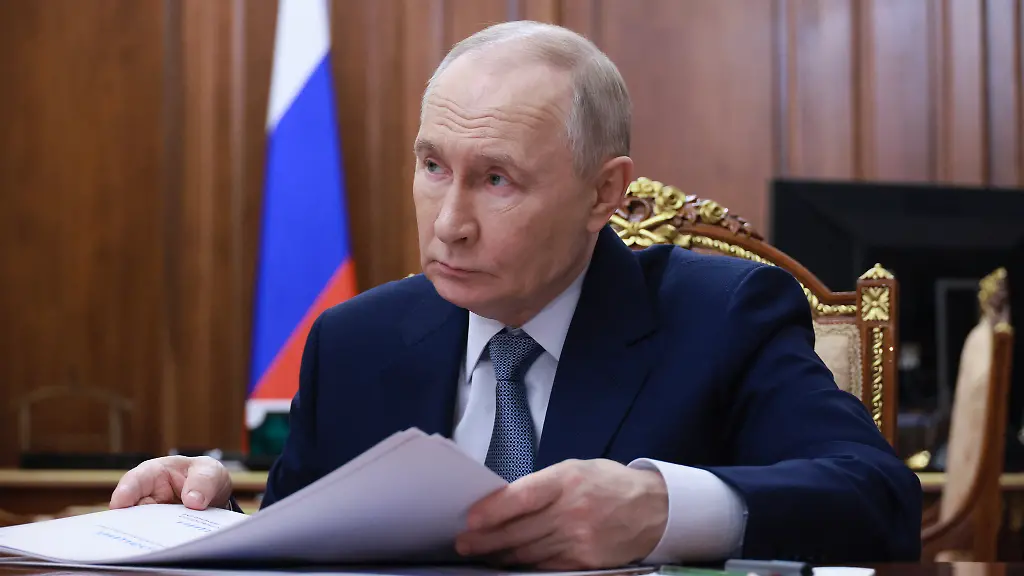 In-this-pool-photograph-distributed-by-the-Russian-state-agency-Sputnik-Russia-s-President-Vladimir-Putin-attends-a-meeting-with-head-of-the-Udmurt-Republic-in-Moscow-on-March-16-2026