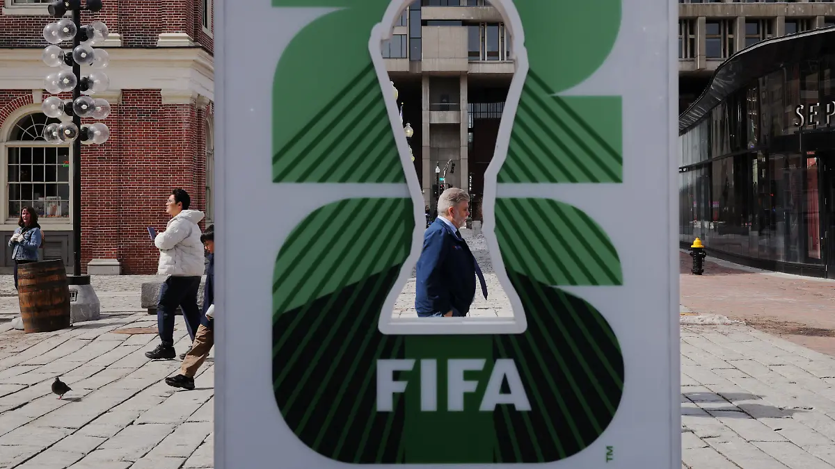 Pedestrians-pass-the-FIFA-World-Cup-2026-countdown-clock-in-Boston-Massachusetts-U-S-March-18-2026