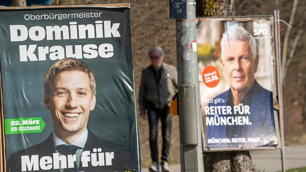 Deutschland-Muenchen-19-Maerz-2026-Wahlplakate-Dominik-Krause-und-Dieter-Reiter-beide-stehen-in-der-Stichwahl-um-das-Amt-des-Muenchner-Oberbuergermeisters-am-22