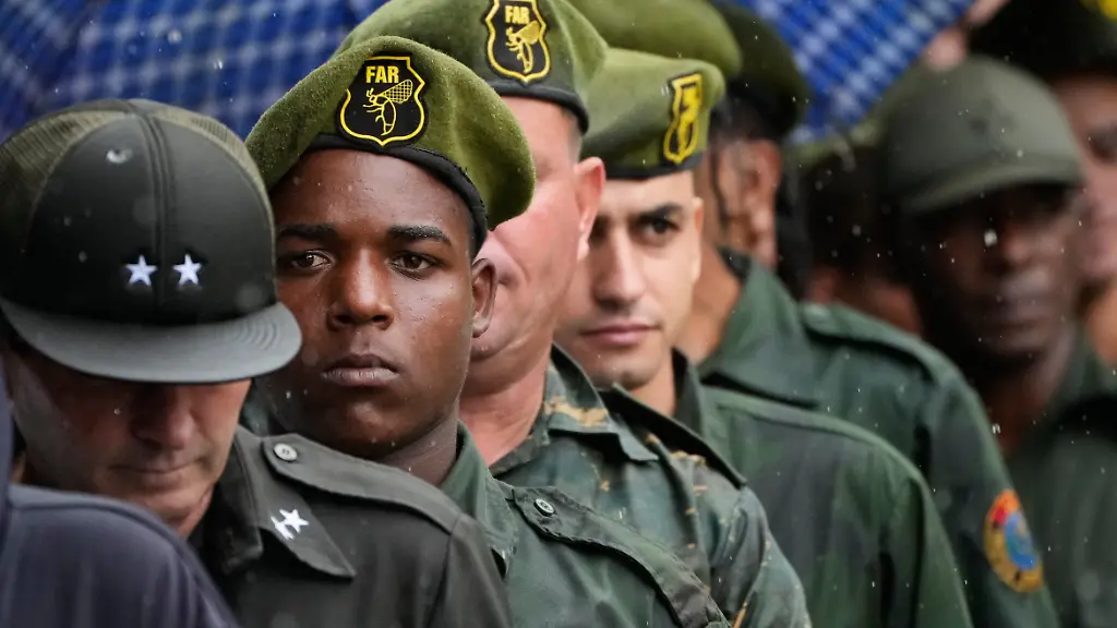 Military-members-line-up-outside-the-Ministry-of-the-Revolutionary-Armed-Forces-where-the-urns-containing-the-remains-of-Cuban-officers-killed-during-the-U-S-operation-in-Venezuela-that-captured-President-Nicolas-Maduro-are-on-display-in-Havana-Cuba-Thursday-Jan-15-2026