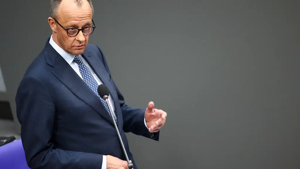 German-Chancellor-Friedrich-Merz-answers-questions-from-lawmakers-during-a-plenum-session-of-the-lower-house-of-parliament-the-Bundestag-in-Berlin-Germany-March-25-2026