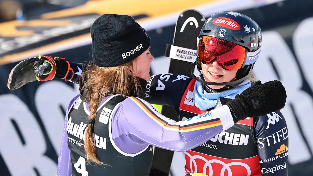 Germany-s-Emma-Aicher-left-and-United-States-Mikaela-Shiffrin-hug-each-other-at-the-finish-area-of-an-alpine-ski-women-s-slalom-race-at-the-Lillehammer-World-Cup-Finals-in-Hafjell-Norway-Tuesday-March-24-2026