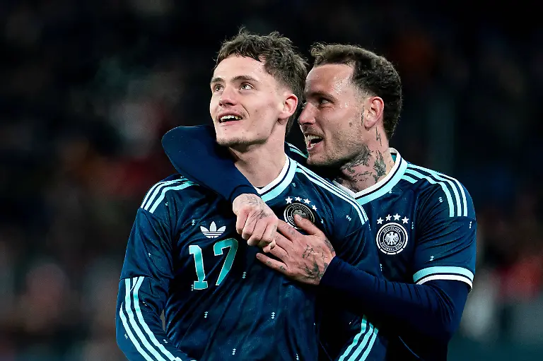 BASEL-SWITZERLAND-MARCH-27-David-Raum-22-Germany-right-and-Florian-Wirtz-17-Germany-left-celebrating-after-teams-third-goal-scored-by-Florian-Wirtz-17-Germany-during-the-friendly-match-between-Switzerland-and-Germany-at-St-Jakob-Park-Stadium-on-March-27-2026-in-Basel-Switzerland