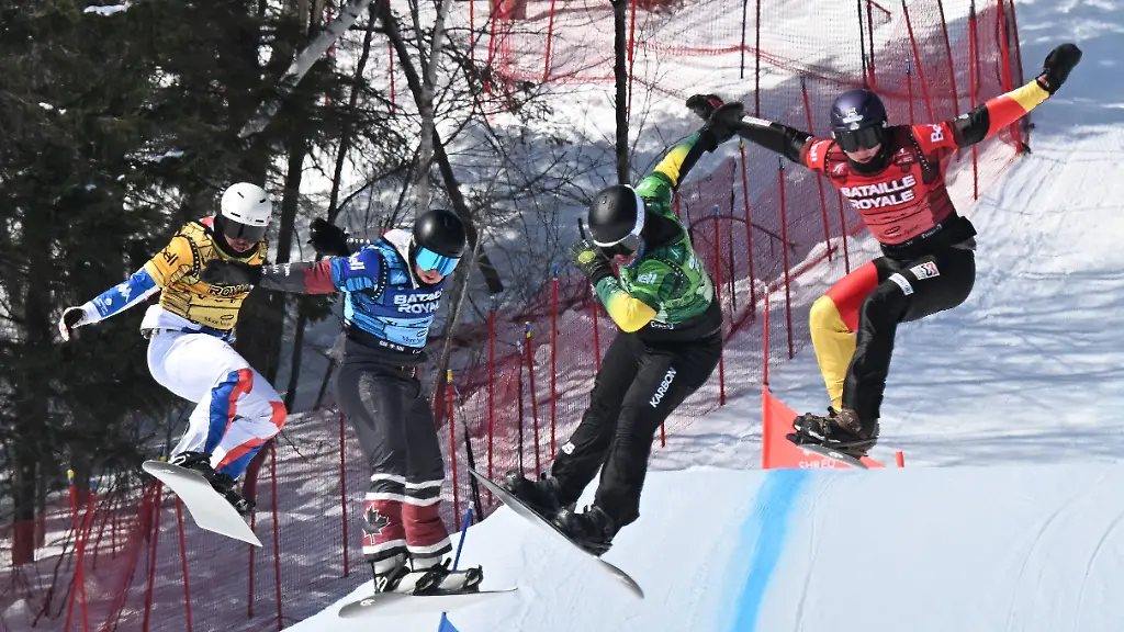 March-28-2026-Beaupre-Pq-Canada-Fourth-place-finish-Julien-Thomas-from-the-left-of-France-third-place-Evan-Bichon-of-Mackenzie-British-Columbia-race-winner-Adam-Lambert-of-Australia-and-second-place-Leon-Ulbricht-of-Germany-leap-to-the-finish-Saturday-March-28-2026-at-the-FIS-snowboard-cross-world-cup-event-at-Mont-Sainte-Anne-resort-in-Beaupre-Quebec