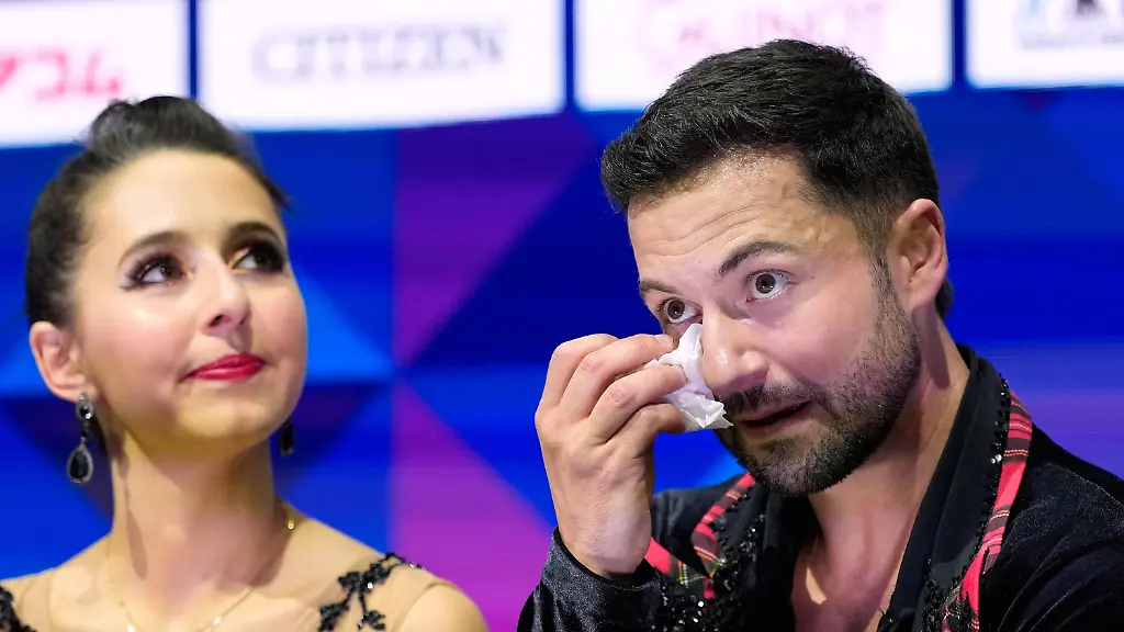 Lilah-Fear-and-Lewis-Gibson-from-Great-Britain-react-upon-seeing-their-score-after-competing-during-the-ice-dance-free-dance-at-the-Figure-Skating-World-Championships-in-Prague-Czech-Republic-Saturday-March-28-2026