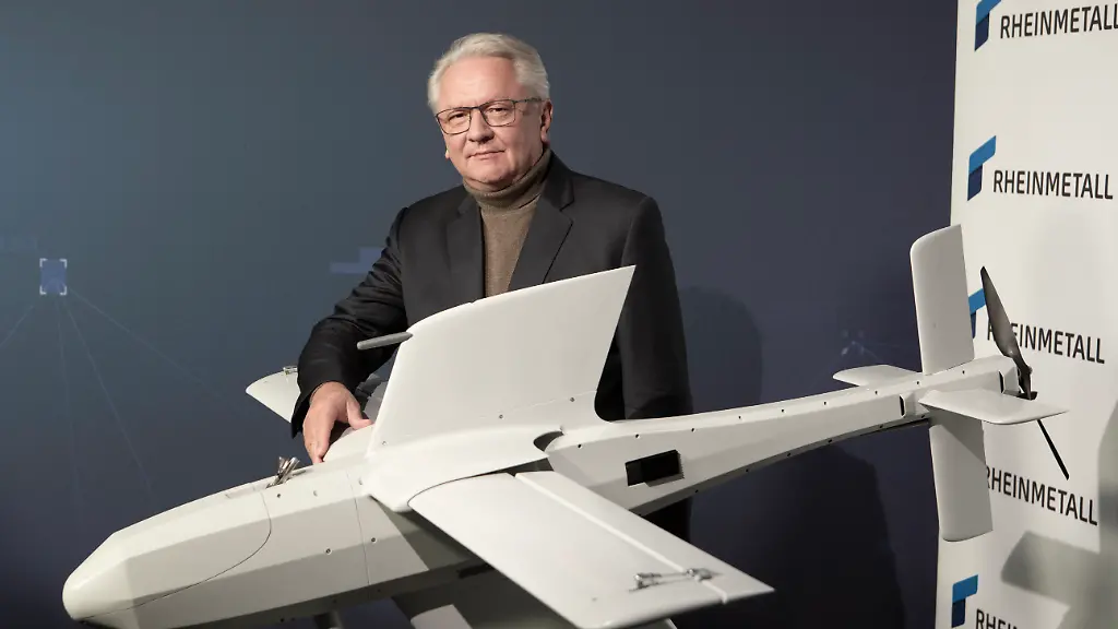 GERMANY-DUESSELDORF-MARCH-11-The-CEO-of-German-automotive-and-arms-manufacturer-Rheinmetall-AG-Armin-Papperger-poses-with-a-Loitering-munition-system-FV-014-Kamikaze-drone-before-addressing-a-virtual-press-conference-to-present-their-2025-annual-results-at-the-company-s-headquarters-on-March-11-2025-in-Duesseldorf-Germany