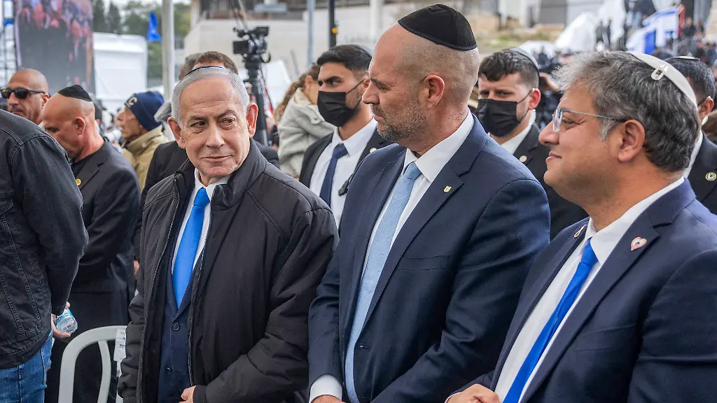 Israel-s-Prime-Minister-Benjamin-Netanyahu-Parliament-Knesset-Speaker-Amir-Ohana-Far-Right-National-Security-Minister-Itamar-Ben-Gvir-Police-Commissioner-Daniel-Levi-family-members-of-Israeli-hostage-Ran-Gvili-whose-remains-were-finally-brought-back-to-Israel-on-January-26-and-other-mourners-applaud-during-Gvili-s-funeral-in-the-southern-town-of-Meitar-Israel-on-Wednesday-January-28-2026-Hundreds-of-tearful-mourners-packed-a-stadium-in-southern-Israel-for-the-funeral-of-Ran-Gvili-the-last-Gaza-hostage-whose-burial-marks-the-end-of-a-painful-national-saga-triggered-by-Hamas-s-2023-attack-Israeli-forces-on-January-26-brought-home-the-remains-of-Gvili-who-was-killed-in-action-and-whose-body-Palestinian-militants-took-into-Gaza-during-their-October-7-attack-which-triggered-a-devastating-two-year-war