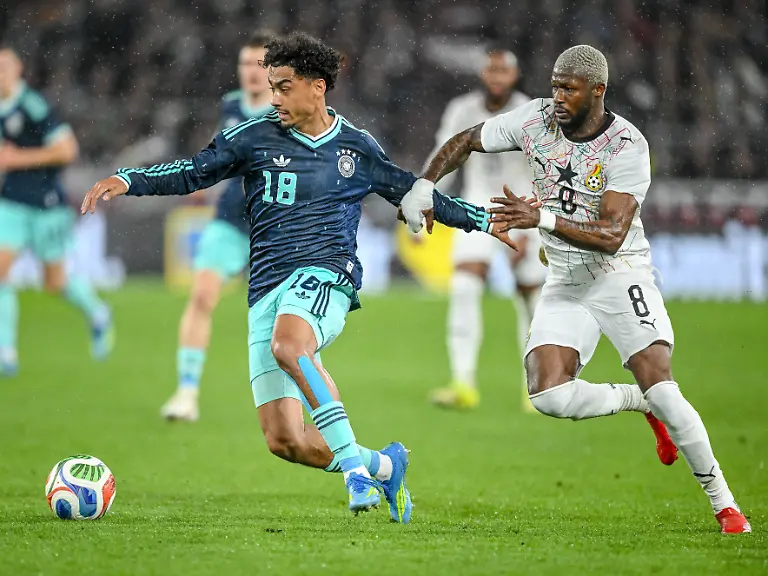 Nathaniel-Brown-Germany-and-Kwasi-Sibo-Ghana-battle-for-the-ball-during-the-international-friendly-match-between-Germany-and-Ghana-at-MHP-Arena-on-March-30-2026-in-Ludwigsburg-Germany