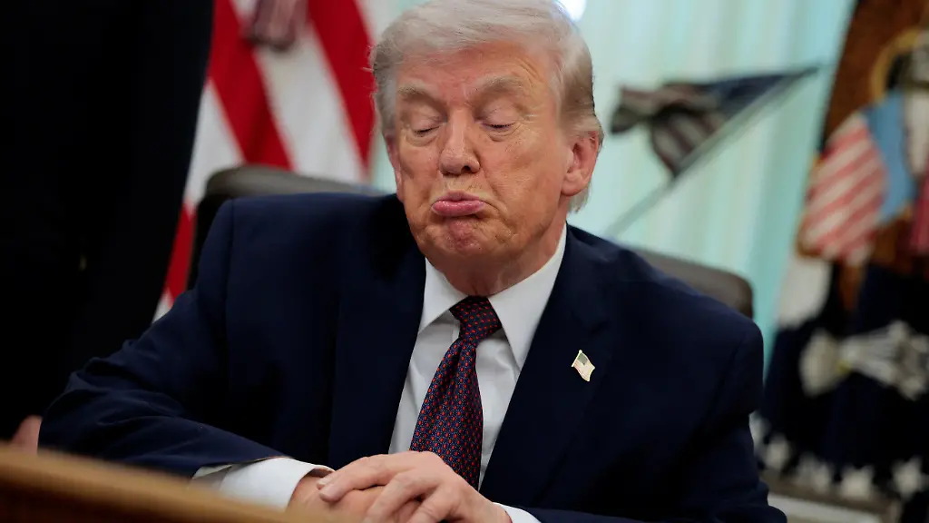 U-S-President-Donald-Trump-reacts-as-he-speaks-during-the-signing-ceremony-for-an-executive-order-on-mail-ballots-in-the-Oval-Office-of-the-White-House-in-Washington-D-C-March-31-2026