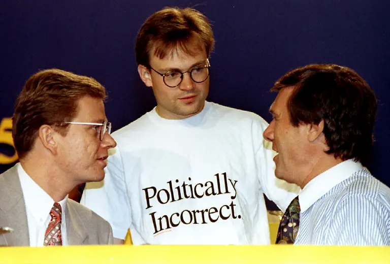 23-years-old-Markus-Schoenherr-C-who-run-for-post-of-party-leader-in-yesterdays-elections-talks-to-newly-elected-FDP-party-leader-Wolfgang-Gerhard-R-and-party-secretary-general-Guido-Westerwelle-L-at-the-annual-party-congress-in-Mainz-June-11-Schoenherr-who-wears-a-t-shirt-with-the-slogan-politically-incorrect-was-elected-as-member-of-the-party-leadership-RTXG09ORTXG09O