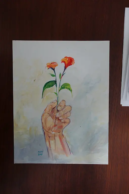 Ansi-Hand-Holding-Red-Flowers