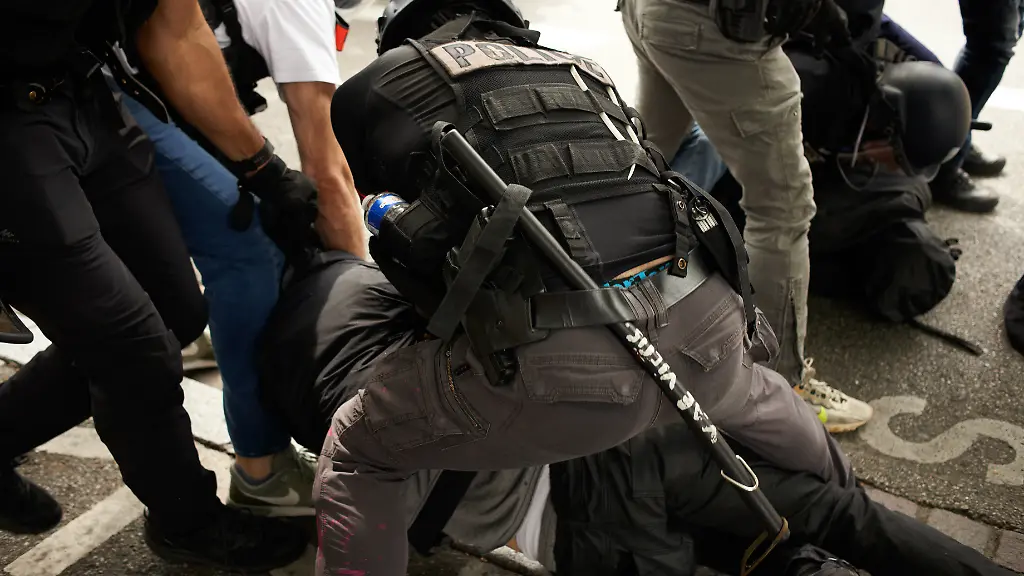 A-pliceman-from-the-BAC-Anti-Crime-Unit-proceed-to-an-arrest-with-a-baton-reading-Vae-victis-ie-Woe-to-the-vanquished-Tens-of-thousands-people-protested-for-the-14th-day-of-protests-against-the-pensionreform-law-which-delay-retirement-by-two-years-to-64-and-was-pushed-through-parliament-by-the-government-without-a-vote-During-the-protest-riot-police-violently-charge-at-protesters-to-cut-the-cortege-in-two-Policemen-used-batons-tear-gas-canisters-pepeer-spays-and-made-several-arr-ests-At-least-two-people-stayed-KO-on-the-ground-and-have-been-arrested-However-the-Constitutional-Council-said-the-same-evening-that-the-pension-bill-is-constitutionnaly-valid-Polls-still-show-93-of-workers-oppose-the-pension-reform-The-retirement-age-would-be-raised-to-64-years-for-43-years-of-continued-work-and-the-pensions-will-be-lower-specially-for-women-short-careers-and-low-wages-people-Toulouse-France-June-6th-2023