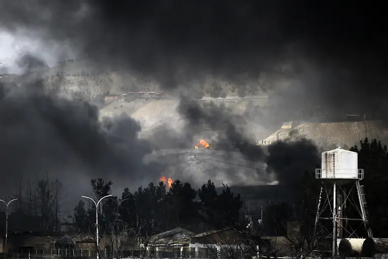 TEHRAN-IRAN-MARCH-8-Black-smoke-rises-after-fires-broke-out-following-US-Israel-attacks-targeting-some-oil-storage-facilities-targeted-including-the-Shehran-oil-depot-in-Tehran-Iran-on-March-8-2026-Explosions-and-ignited-leaking-petroleum-from-the-depot-caused-severe-damage-to-nearby-vehicles-as-intense-flames-engulfed-the-area-following-the-strike-Firefighting-teams-try-to-control-the-spreading-fires-and-contain-the-damage-in-the-heavily-affected-industrial-zone