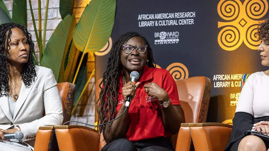 Coral-Springs-Commissioner-Nancy-Metayer-Bowen-center-speaks-during-the-Out-of-Many-One-Community-Combating-Anti-Immigrant-Rhetoric-panel-discussion-hosted-by-South-Florida-People-of-Color-at-the-African-American-Cultural-Research-Center-on-Thursday-October-17-2024-in-Miami-D-A