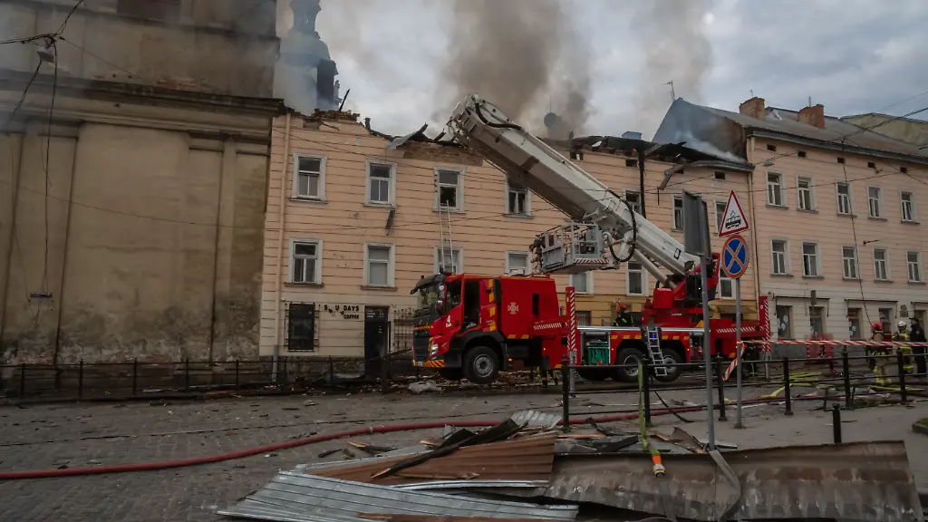 March-24-2026-Lviv-Ukraine-Firefighters-extinguish-a-burning-building-after-a-drone-attack-Emergency-services-are-cleaning-up-the-aftermath-of-a-Russian-drone-strike-on-the-15th-century-Bernardine-Church-and-Monastery-a-UNESCO-World-Heritage-Site-in-central-Lviv-At-around-4-30-p-m-Russia-launched-at-least-5-drones-over-Lviv-Multiple-hits-and-19-injuries-were-reported-at-least-two-of-them-in-serious-condition-Russia-has-launched-more-than-948-drones-over-Ukraine-this-24-hours-906-of-them-were-shot-down-This-is-one-of-the-most-massive-attacks