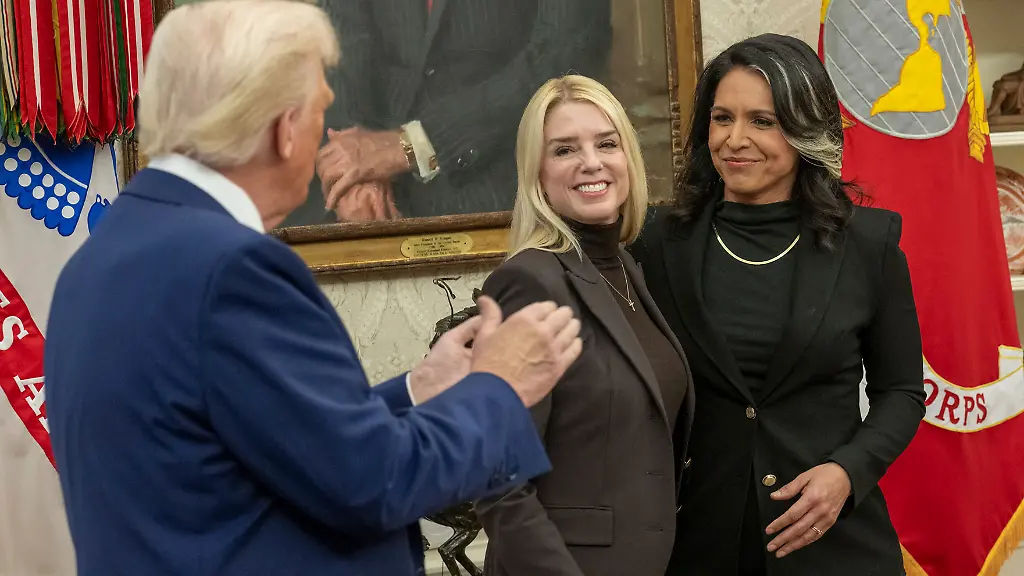 February-12-2025-Washington-Dc-United-States-U-S-President-Donald-Trump-left-applauds-after-Attorney-General-Pamela-Jo-Bondi-2nd-left-performed-the-swearing-in-ceremony-of-Director-of-National-Intelligence-Tulsi-Gabbard-2nd-right-as-her-husband-Abraham-William-right-looks-on-at-the-Oval-Office-of-the-White-House-February-12-2025-in-Washington-D-C