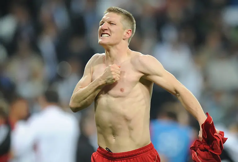 Munich-s-Bastian-Schweinsteiger-reacts-after-winning-the-penalty-shoot-out-of-the-Champions-League-semi-final-second-leg-soccer-match-between-Real-Madrid-and-FC-Bayern-Munich-at-the-Santiago-Bernabeu-stadium-in-Madrid-Spain-25-April-2012