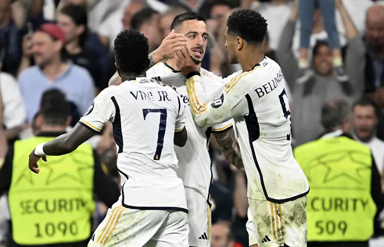 MADRID-SPAIN-MAY-08-Joselu-Mato-of-Real-Madrid-celebrates-with-his-teammates-after-scoring-a-goal-during-the-UEFA-Champions-League-Semi-Final-second-leg-football-match-between-Real-Madrid-and-Bayern-Munich-at-Santiago-Bernabeu-Stadium-in-Madrid-Spain-on-May-08-2024