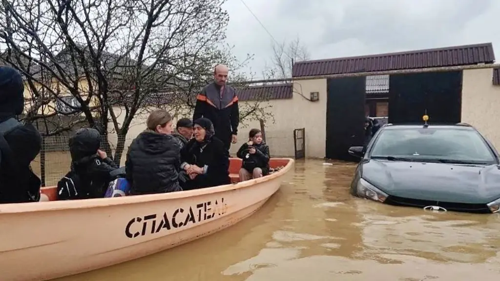 In-this-image-made-from-video-provided-by-Russian-Emergency-Ministry-Press-Service-on-Sunday-April-5-2026-Emergency-Situations-Ministry-personnel-evacuate-people-from-a-flood-zone-in-the-Derbent-district-of-the-Republic-of-Dagestan-Russia