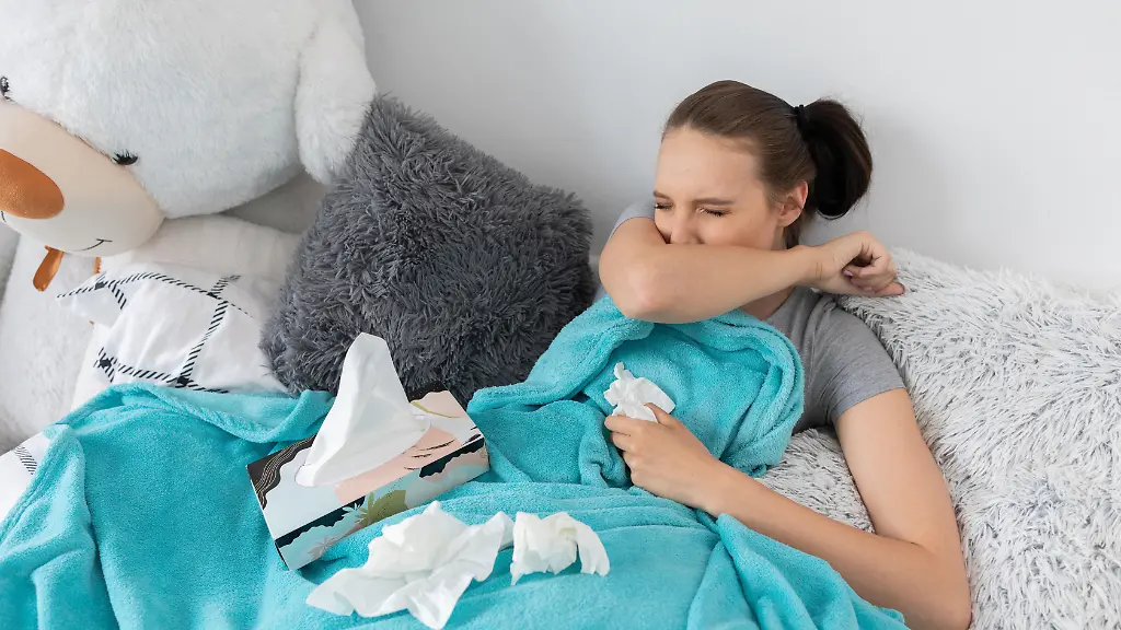 Strong-cough-on-the-elbow-by-a-very-cold-young-teenager-who-is-lying-in-her-bed