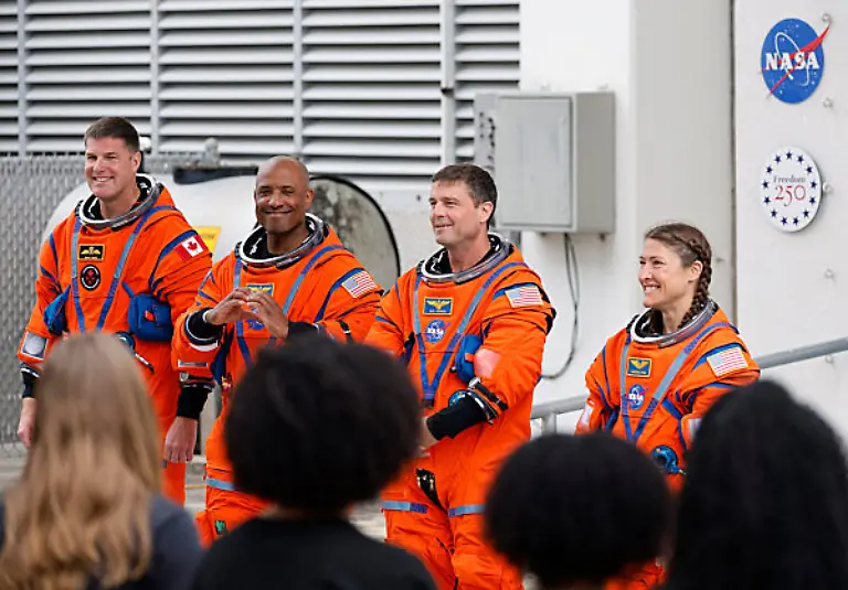 From-left-The-Artemis-II-crew-mission-specialist-Jeremy-Hansen-pilot-Victor-Glover-commander-Reid-Wiseman-and-mission-specialist-Christina-Koch-pose-for-photos-as-they-walk-out-on-the-way-to-Launch-Complex-39B-for-their-mission-to-the-Moon-on-Wednesday-April-1-2026-Ricardo-Ramirez-Buxeda-Orlando-Sentinel-TNS-ABACAPRESS