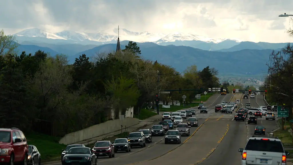 Rain-clouds-roll-off-the-Rocky-Mountains-as-motorists-slog-through-evening-rush-hour-traffic-eastbound-on-Hampden-Avenue-Friday-April-26-2024-in-southeast-Denver-Forecasters-are-predicting-that-a-spring-storm-will-dump-rain-along-the-Front-Range-and-snow-in-some-mountain-locations-before-moving-on-to-the-Great-Plains