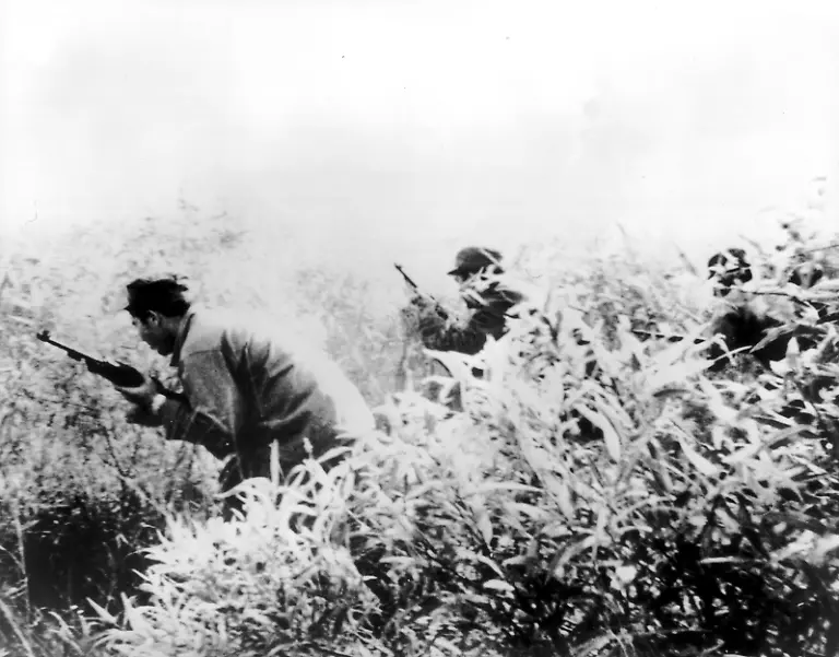 Cuban-exiles-go-through-the-undergrowth-in-training-for-the-invasion-in-Cuba-on-April-17th-1961