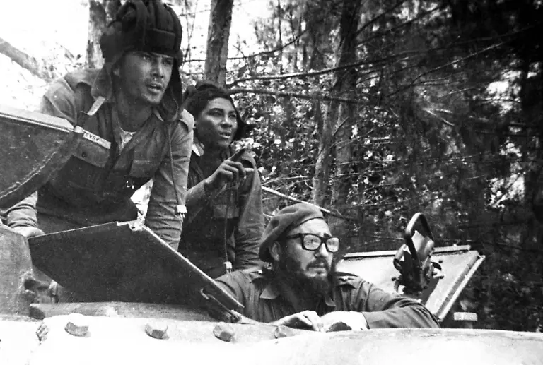 FILE-In-this-April-1961-file-photo-Cuba-s-leader-Fidel-Castro-bottom-looks-out-from-a-tank-during-the-Bay-of-Pigs-invasion-in-Cuba-Former-President-Fidel-Castro-who-led-a-rebel-army-to-improbable-victory-in-Cuba-embraced-Soviet-style-communism-and-defied-the-power-of-10-U-S-presidents-during-his-half-century-rule-has-died-at-age-90-The-bearded-revolutionary-who-survived-a-crippling-U-S-trade-embargo-as-well-as-dozens-possibly-hundreds-of-assassination-plots-died-eight-years-after-ill-health-forced-him-to-formally-hand-power-over-to-his-younger-brother-Raul-who-announced-his-death-late-Friday-Nov-25-2016-on-state-television