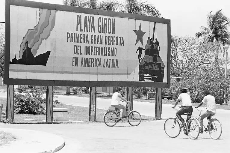 Original-Caption-Bay-of-Pigs-Cuba-When-1-500-Cuban-exiles-invaded-their-homeland-on-April-17-1961-the-motherland-fought-for-the-first-time-under-the-banner-of-socialism-and-delt-the-US-backed-force-a-resounding-defeat-The-billboard-in-the-little-resort-town-of-Giron-about-50-yards-from-Playa-Giron-and-one-of-the-landing-places-expresses-the-pride-Cubans-view-their-victory-with-Referring-to-their-name-for-the-battle-of-the-Bay-of-Pigs-it-reads-Giron-Beach-the-first-great-defeat-in-Latin-America