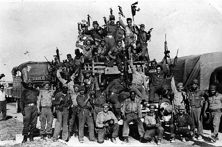 Cuban-soldiers-pose-for-pictures-as-they-celebrate-the-failure-of-an-invasion-to-Bahia-de-Cochinos-Bay-of-Pigs-in-Cuba-April-1961-The-Bay-of-Pigs-invasion-was-an-unsuccessful-CIA-sponsored-invasion-of-Cuba-by-Cuban-exiles