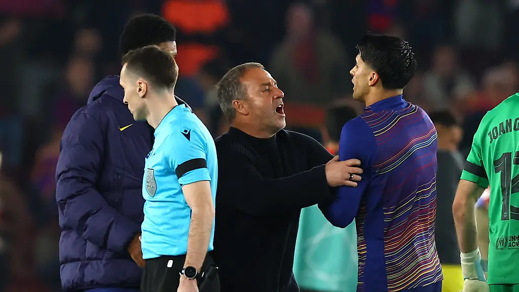 Soccer-Football-UEFA-Champions-League-Quarter-Final-First-Leg-FC-Barcelona-v-Atletico-Madrid-Spotify-Camp-Nou-Barcelona-Spain-April-8-2026-FC-Barcelona-coach-Hansi-Flick-pushes-away-Joao-Cancelo-from-referees-after-the-match-REUTERS-Albert-Gea