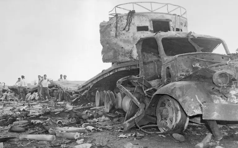 Original-Caption-Destroyed-during-air-raid-Havana-A-wrecked-ammunition-truck-bears-mute-evidence-of-air-attack-on-Camp-Liberty-April-15th-Warplanes-bombed-and-strafed-targets-in-Havana-and-two-other-Cuban-cities-Premier-Fidel-Castro-blamed-the-United-States-for-the-attacks-Castro-mobilized-his-300-000-man-militia-to-defend-the-beaches-against-invasion-Two-of-the-attacking-aircraft-later-landed-in-Florida-where-their-pilots-identified-themselves-as-defecting-Cuban-Air-Force-officers
