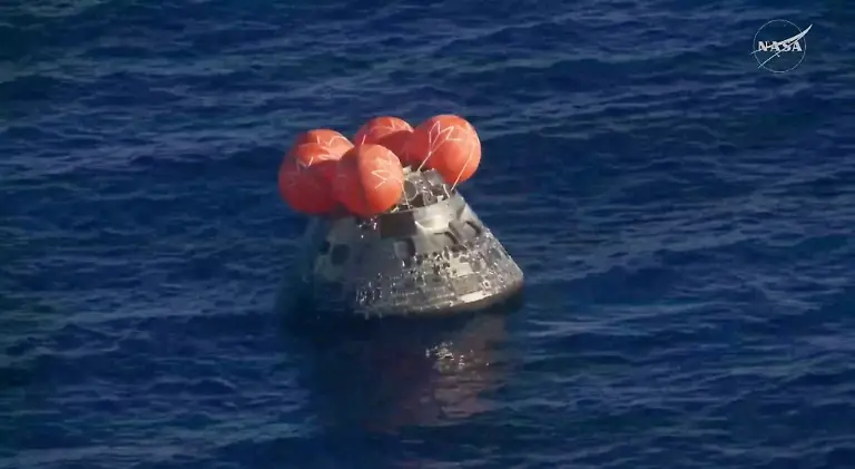 The-Artemis-II-crew-capsule-floats-in-the-Pacific-Ocean-following-splashdown-in-this-screengrab-from-a-livestream-video-after-the-Artemis-II-crew-s-flyby-of-the-Moon-April-10-2026