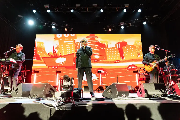 Gerald-Casale-from-left-Mark-Mothersbaugh-and-Bob-Mothersbaugh-of-Devo-performs-during-the-first-weekend-of-Coachella-Valley-Music-and-Arts-Festival-on-Friday-April-10-2026-in-Indio-Calif
