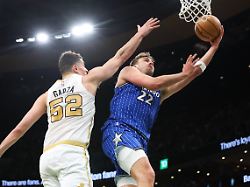 Apr 12 2026 Boston Massachusetts USA Orlando Magic Forward Franz Wagner 22 Shoots Defended By Boston Celtics Forward Luka Garza 52 During The First Half At TD Garden