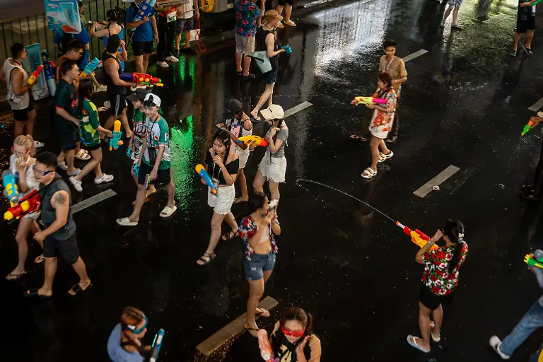 April-12-2026-Bangkok-Thailand-People-celebrate-the-start-of-Songkran-on-Silom-Road-engaging-in-large-scale-water-fights-as-part-of-the-Thai-New-Year-festivities-The-kickoff-of-Songkran-on-Silom-Road-marks-the-start-of-Thailandas-New-Year-with-one-of-Bangkokas-most-iconic-celebrations-Traditionally-rooted-in-rituals-of-cleansing-and-renewal-the-festival-has-evolved-into-a-vibrant-public-event-where-crowds-gather-for-large-scale-water-fights-Silom-with-its-central-location-and-lively-atmosphere-has-become-a-key-hotspot-drawing-both-locals-and-visitors-into-the-heart-of-the-festivities