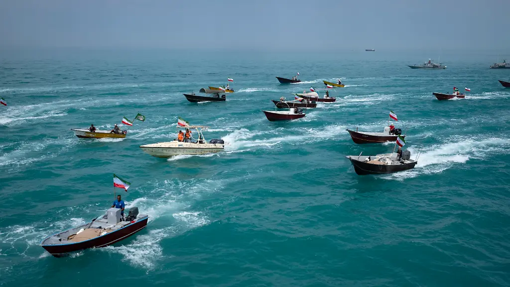 Basij-paramilitary-force-speed-boats-are-sailing-along-the-Persian-Gulf-during-the-Islamic-Revolutionary-Guard-Corps-IRGC-marine-parade-to-commemorate-Persian-Gulf-National-Day-near-the-Bushehr-nuclear-power-plant-in-the-seaport-city-of-Bushehr-Bushehr-province-in-the-south-of-Iran-on-April-29-2024-Persian-Gulf-National-Day-which-celebrates-the-expulsion-of-the-Portuguese-from-the-Strait-of-Hormuz-and-the-Persian-Gulf-in-1622-by-the-Safavid-forces-led-by-Imam-Quli-Khan-under-the-command-of-Shah-Abbas-I-is-observed-on-the-10th-of-Ordibehesht-in-the-Iranian-calendar-typically-falling-in-late-April-or-early-May