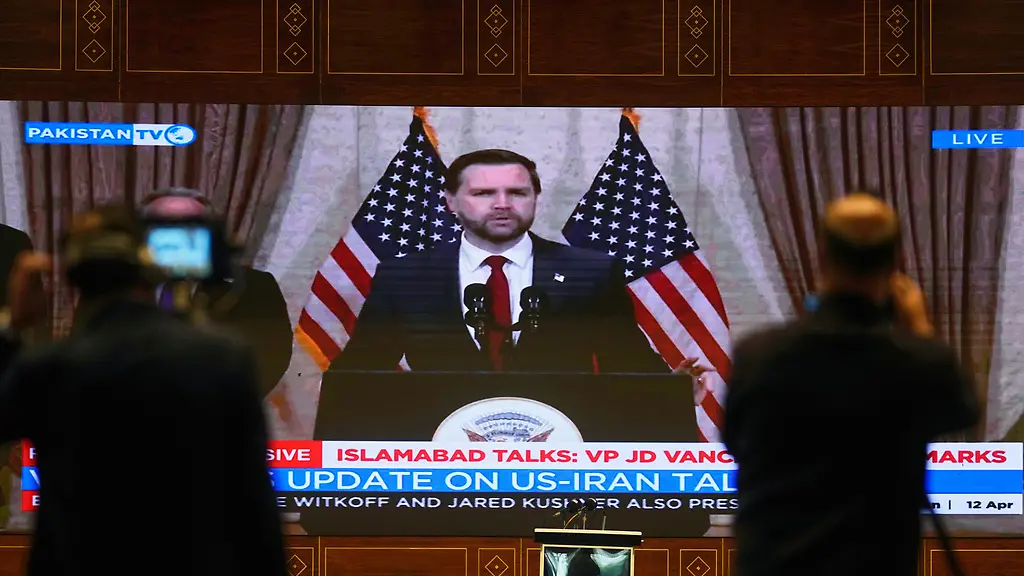 Cameramen-film-U-S-Vice-President-JD-Vance-s-speech-telecast-by-state-run-television-after-his-meeting-with-Iranian-officials-at-a-media-center-in-Islamabad-Pakistan-Sunday-April-12-2026