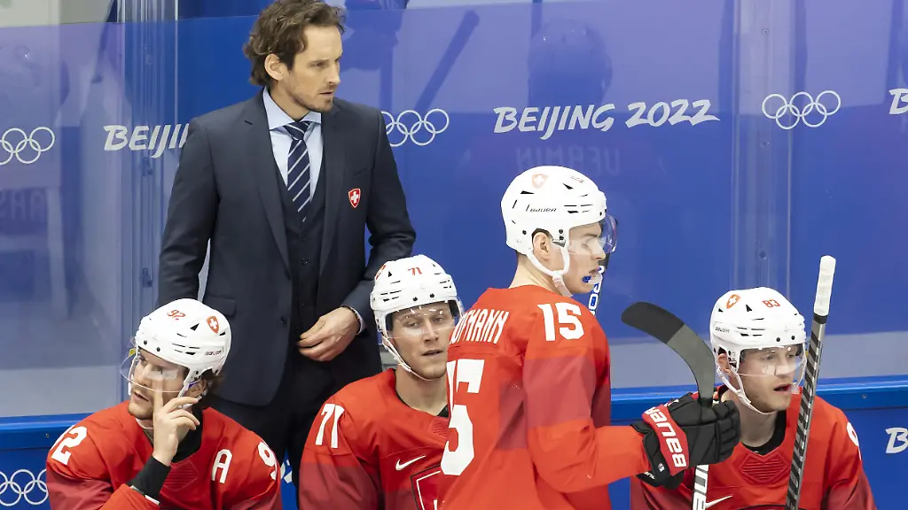 Patrick-Fischer-head-coach-of-Switzerland-national-ice-hockey-team-looks-the-game-during-the-men-s-ice-hockey-qualification-play-off-game-between-the-Czech-Republic-and-Switzerland-at-the-National-Indoor-Stadium-at-the-2022-Winter-Olympics-in-Beijing-China-on-Tuesday-February-15-2022