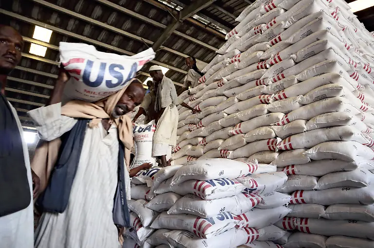 Grains-are-transported-by-the-World-Food-Programme-WFP-from-a-warehouse-to-trucks-carrying-aid-to-the-capital-Khartoum-in-Port-Sudan-eastern-Sudan-on-May-3-2025-The-fighting-between-the-Sudanese-army-and-the-paramilitary-Rapid-Response-Forces-RSF-which-began-in-April-2023-has-entered-its-third-year-and-the-humanitarian-situation-is-becoming-more-serious-In-August-last-year-the-world-experienced-its-first-famine-in-seven-years-but-aid-has-been-hindered-by-the-fighting-and-25-6-million-people-or-about-half-of-the-population-are-facing-a-food-crisis