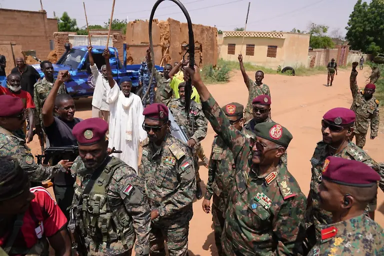 250928-EL-OBEID-Sept-28-2025-Xinhua-This-photo-taken-with-a-mobile-phone-on-Sept-27-2025-shows-Chairman-of-Sudan-s-Transitional-Sovereign-Council-and-Commander-of-the-Sudanese-Armed-Forces-SAF-Abdel-Fattah-Al-Burhan-2nd-R-front-saluting-citizens-who-gather-to-welcome-him-in-El-Obeid-North-Kordofan-State-Sudan-The-Sudanese-Armed-Forces-SAF-announced-Saturday-that-it-had-achieved-significant-victories-in-its-fight-against-the-paramilitary-Rapid-Support-Forces-RSF-in-western-Sudan-s-Kordofan-region