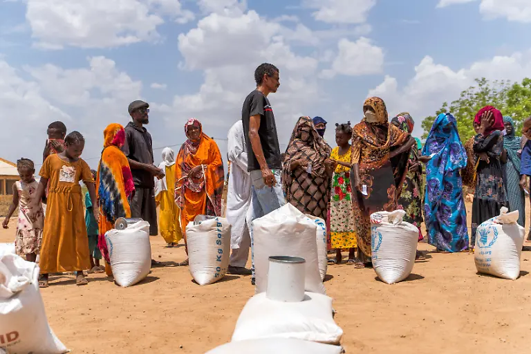 This-June-2023-photo-provided-by-the-World-Food-Program-shows-food-distribution-by-the-WFP-for-internally-displaced-persons-at-the-Wad-Almajzoub-farm-camp-in-Wad-Medani-Gezira-state-Sudan-Ala-Kheir-U-N