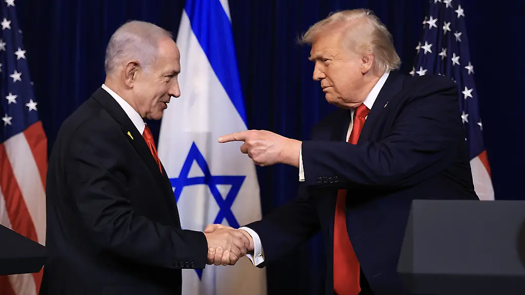 PALM-BEACH-FLORIDA-DECEMBER-29-EDITOR-S-NOTE-Alternate-crop-U-S-President-Donald-Trump-shakes-hands-with-Israeli-Prime-Minister-Benjamin-Netanyahu-during-a-press-conference-at-his-Mar-a-Lago-club-on-December-29-2025-in-Palm-Beach-Florida-The-two-leaders-held-a-bilateral-meeting-to-discuss-regional-security-in-the-Middle-East-as-well-as-the-U-S-Israel-partnership