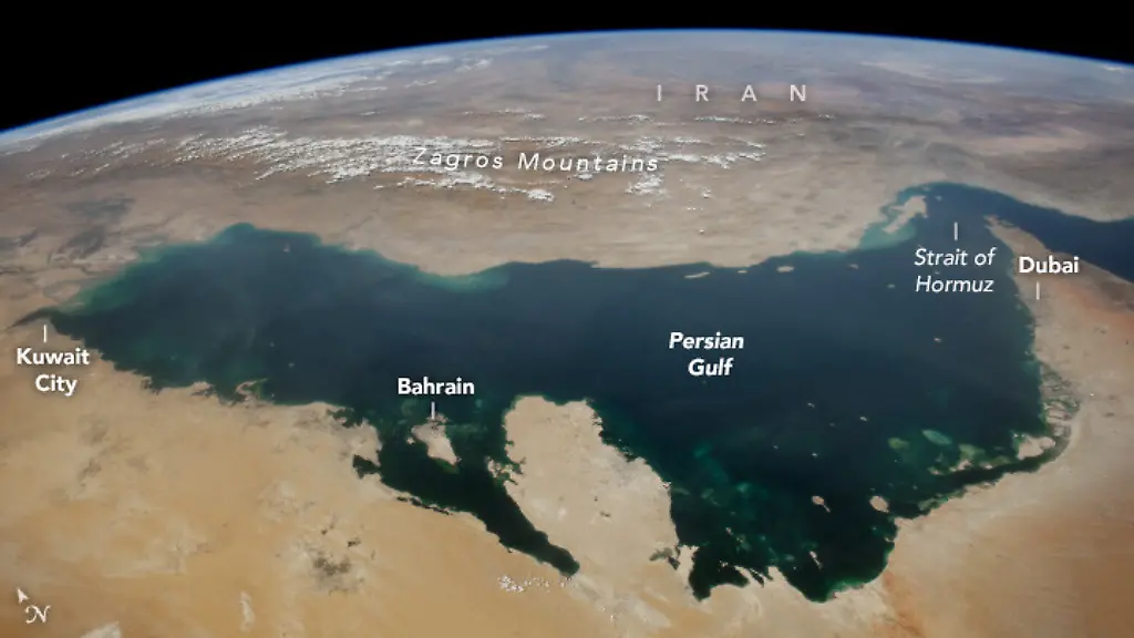 An-astronaut-aboard-the-International-Space-Station-captured-this-highly-oblique-photograph-of-the-Persian-Gulf-while-in-orbit-over-Saudi-Arabia-The-Gulf-drains-into-the-Indian-Ocean-through-the-Strait-of-Hormuz-and-forms-part-of-the-border-for-eight-countries-Iran-Iraq-Kuwait-Saudi-Arabia-Bahrain-Qatar-the-United-Arab-Emirates-and-Oman-The-Persian-Gulf-occupies-a-large-depression-formed-by-a-tectonic-subduction-zone-between-the-Arabian-and-Eurasian-plates-The-collision-of-these-two-tectonic-plates-also-produced-the-Zagros-Mountains-in-southern-Iran-visible-to-the-north-northwest-of-the-Persian-Gulf-The-image-shows-several-cities-concentrated-along-the-coastline-that-serve-as-ports-for-goods-moving-in-and-out-of-the-region