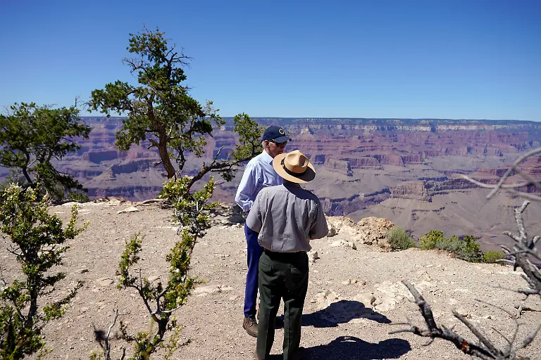 President-Joe-Biden-talks-with-Ed-Keable-superintendent-of-Grand-Canyon-National-Park-in-Grand-Canyon-Village-Ariz-Tuesday-Aug-8-2023-as-he-views-the-South-Rim-of-the-canyon-at-Yaki-Point