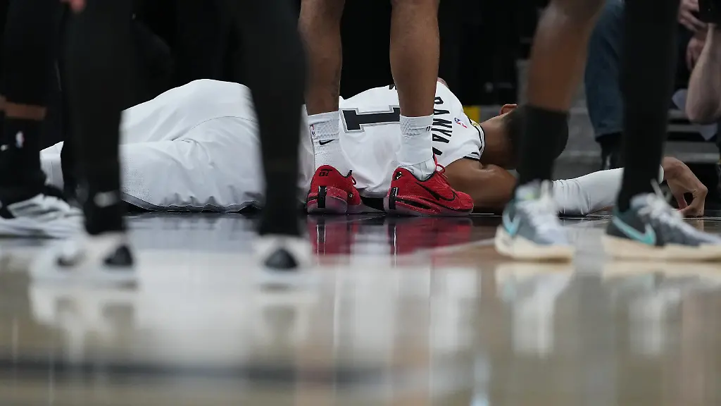 San-Antonio-Spurs-forward-Victor-Wembanyama-1-lies-on-the-court-after-a-hard-fall-during-the-first-half-in-Game-2-of-a-first-round-NBA-playoffs-basketball-series-against-the-Portland-Trail-Blazers-in-San-Antonio-Tuesday-April-21-2026