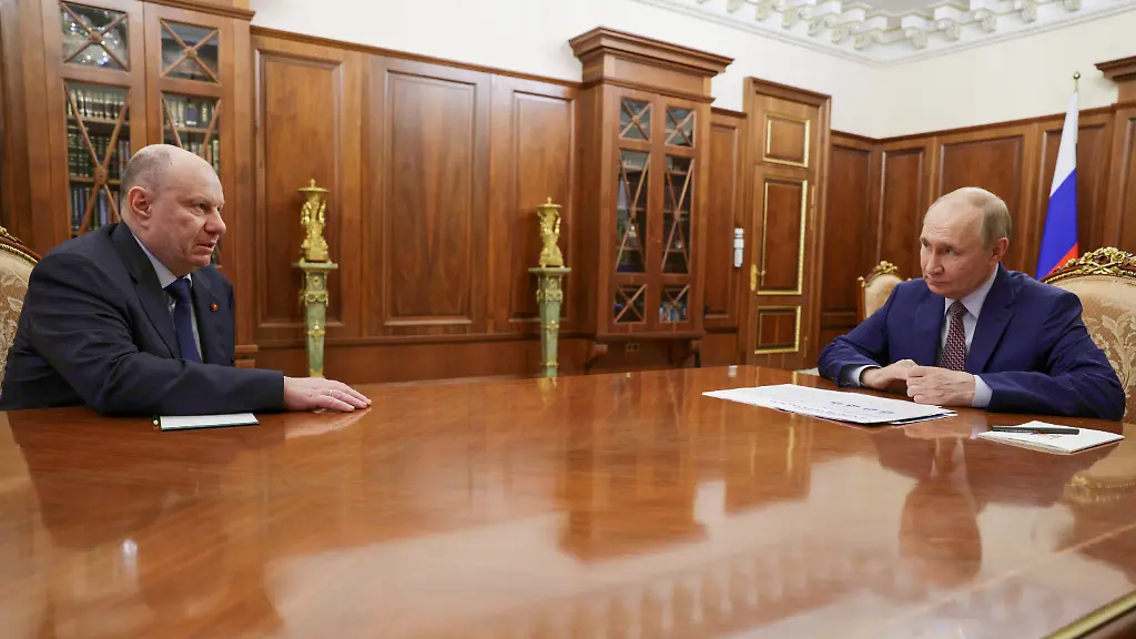Russian-President-Vladimir-Putin-right-listens-to-Nornikel-metallurgical-company-CEO-Vladimir-Potanin-during-their-meeting-at-the-Kremlin-in-Moscow-Russia-Tuesday-Oct-14-2025