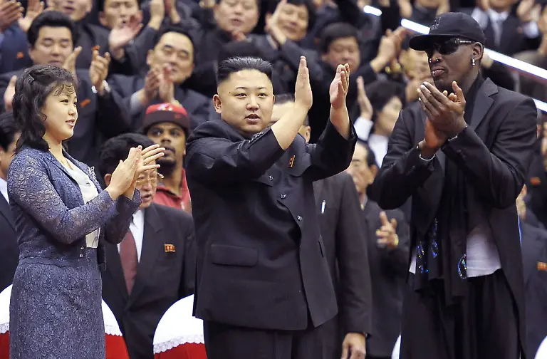 epa03605321-A-picture-taken-on-28-February-2013-and-released-by-the-North-Korean-Central-News-Agency-KCNA-on-01-March-shows-North-Korean-leader-Kim-Jong-Un-C-his-wife-Ri-Sol-ju-L-and-former-NBA-player-Dennis-Rodman-R-clap-during-a-basketball-game-between-the-Harlem-Globetrotters-team-and-North-Korean-University-of-Physical-Education-players-belonging-to-the-Hwaebul-basketball-team-at-the-Ryugyong-Jong-Ju-Yong-Gymnasium-in-Pyongyang-North-Korea