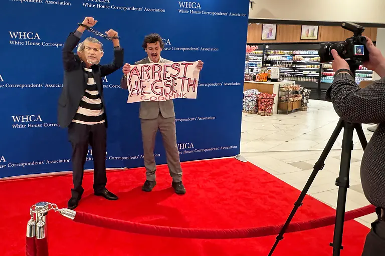 Protesters-are-forcibly-removed-from-the-red-carpet-at-the-White-House-Correspondents-Dinner-Saturday-April-25-2026-in-Washington