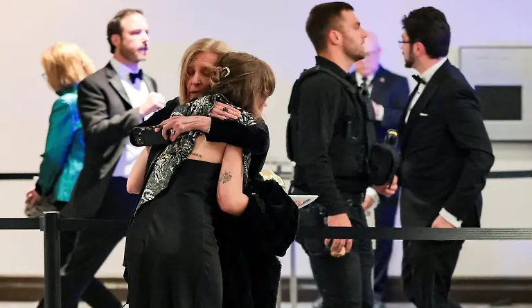 People-embrace-following-a-shooting-incident-during-the-annual-White-House-Correspondents-Association-dinner-in-Washington-D-C-U-S